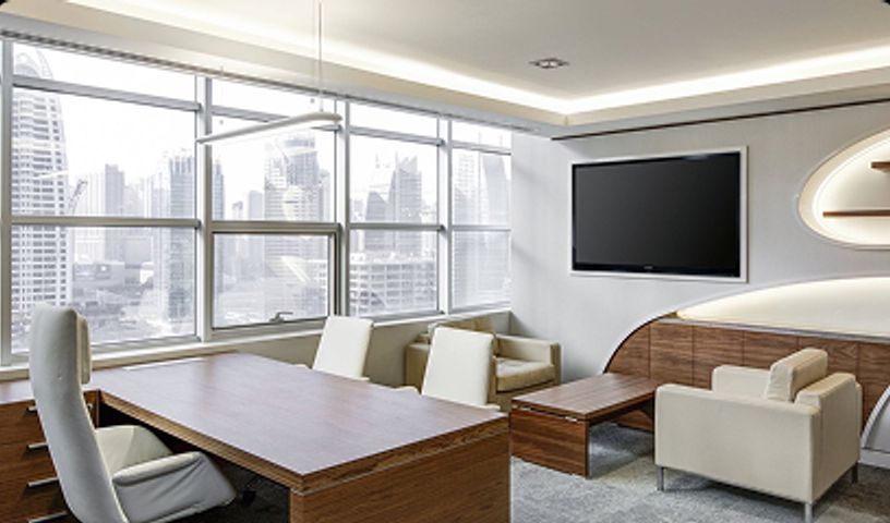 Office with desk, chairs and tv