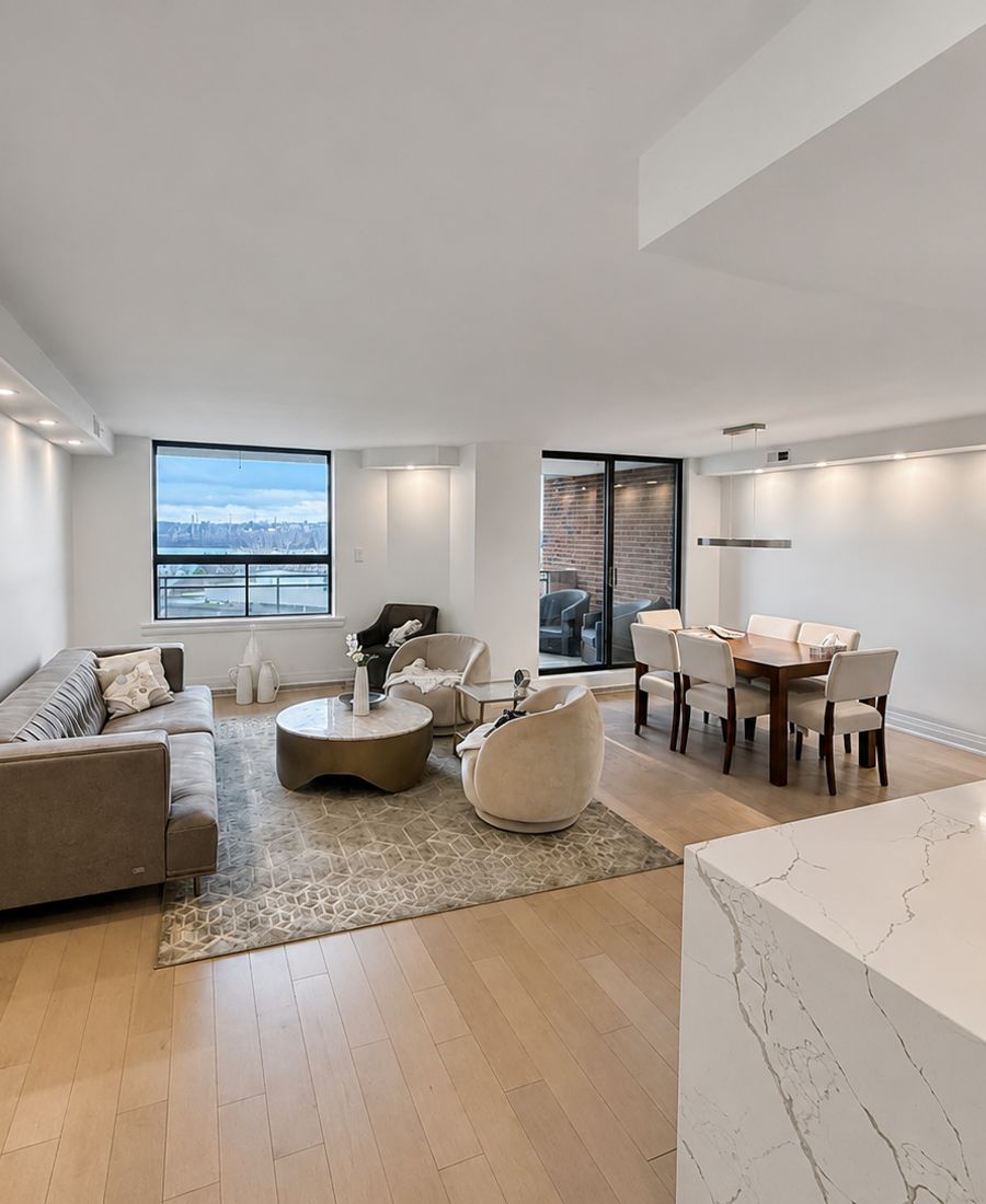 Bright open-concept condo with freshly painted living and dining area, white ceilings, and refreshed trim in Ottawa