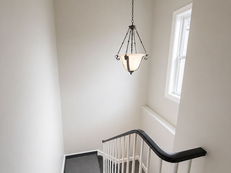 Freshly painted Ottawa home stairwell with crisp neutral walls and white trim