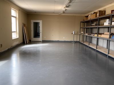 Bright commercial space with a painted concrete floor