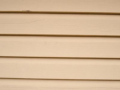 Painted wood siding with visible grain texture